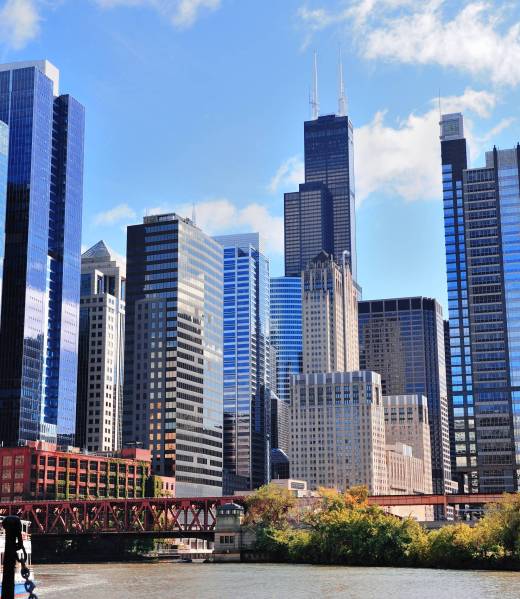 Chicago city downtown urban skyline with skyscrapers and cloudy blue sky.